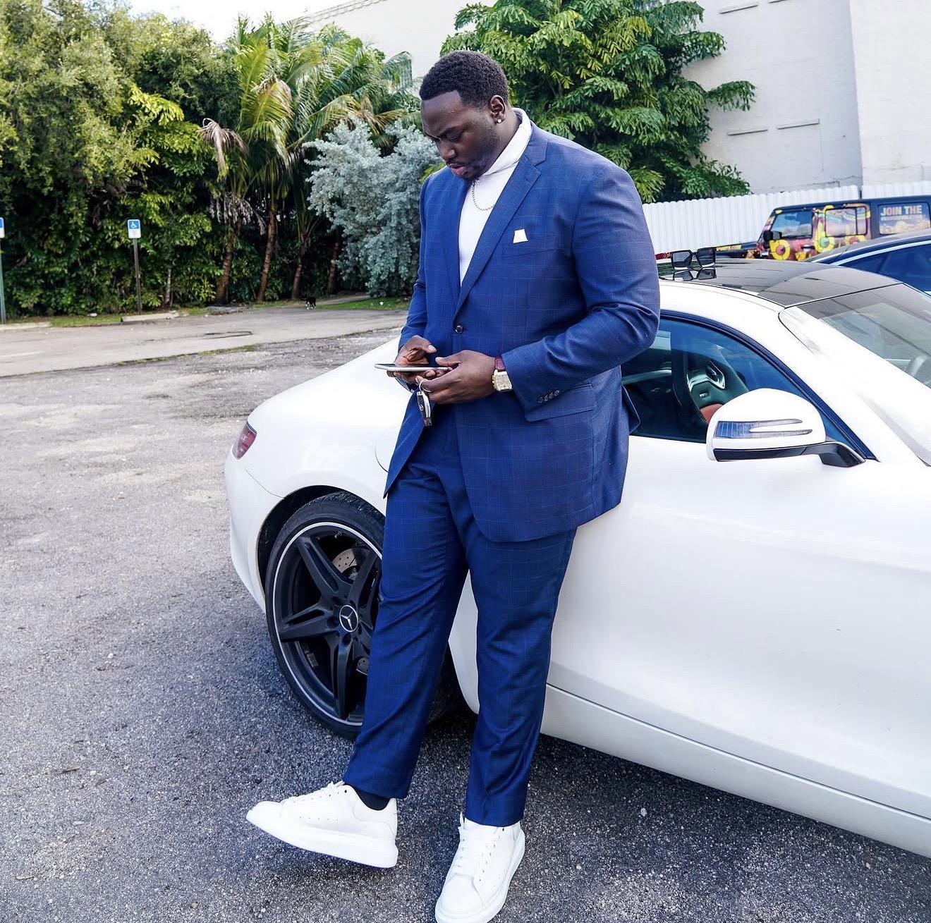 Manny in a blue suit